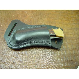 Custom Left Hand Cross Draw Knife Sheath for a Buck 110 Knife. The Sheath is Made Out of Buffalo Hide Leather Dyed Black.