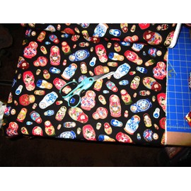 Elizabeth Studios Russian Nesting Dolls Outline in Gold   BTY   100% Cotton.