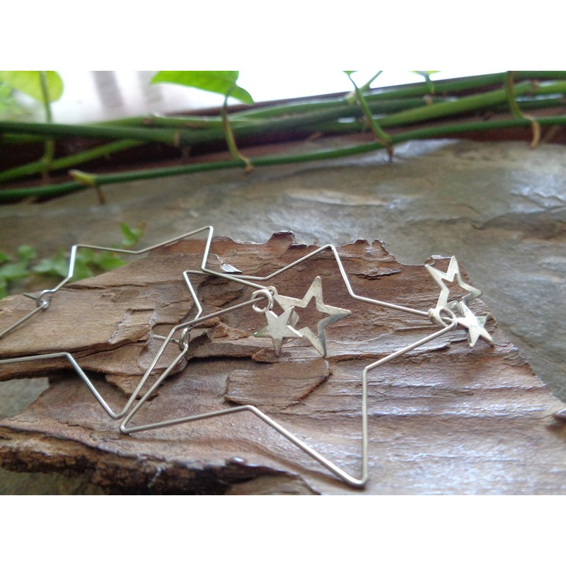 Delicate star hoop earrings made of stainless steel. Star-shaped large