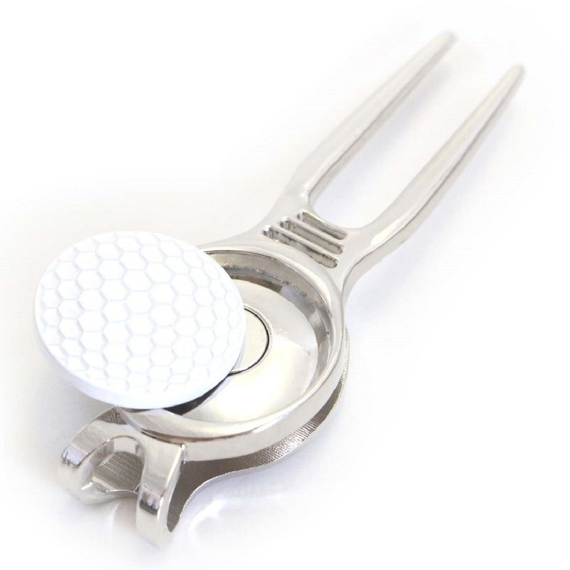 divot tool white golf ball white golf ball green fork