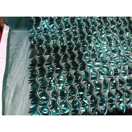 NEW CREATIONS FABRIC AND FOAM INC HUNTER GREEN CHEVRON EMBROIDERY WITH LONG SEQUINS ON A MESH-SOLD BY THE YARD.