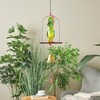 Deco 79 Metal Parrot Handmade Perched Windchime with Hanging Bell,