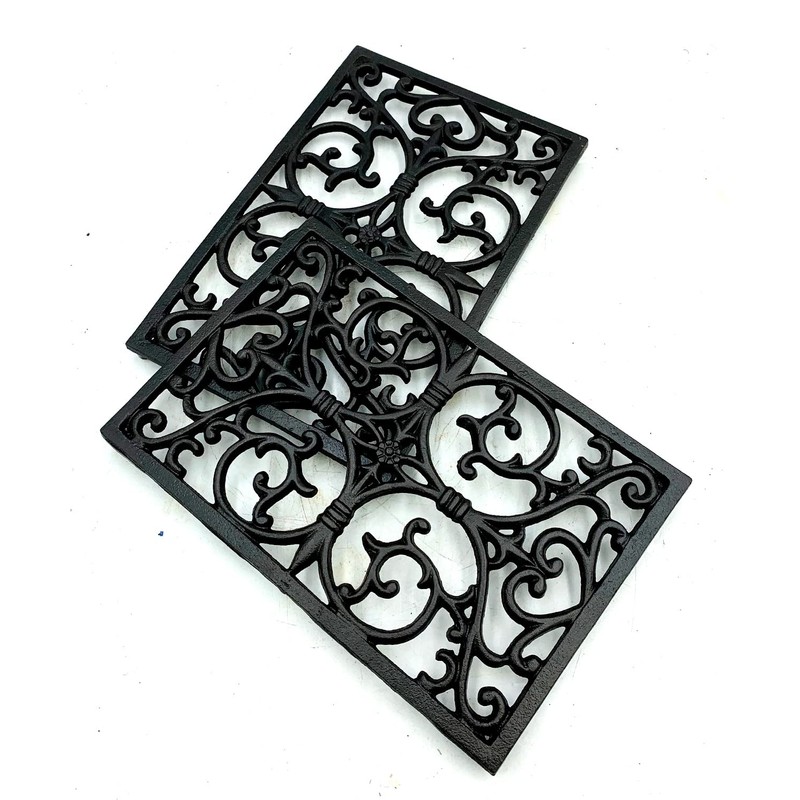 Delightful rectangular decorative cast iron trivet - ideal to protect
