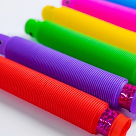 Toyseum 12 x Light Up Pop Tubes, Fun Light Up Sensory Toys for Kids Party Favours, Goody Bag Fillers for Kids, Fidget Toys for Boys Girls Party Bag Fillers, Pack of 12 (6 Unique Colours)