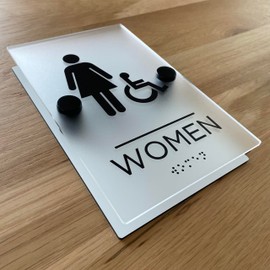 Restroom sign, matte acrylic with stainless steel mounting hardware (5" x 8" "WOMEN" with handicap (wheelchair accessible) and braille)