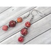 Chic and classic Thurcolas dangling earrings made of red imperial