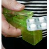 A punch for abbreviation ("Opa!") An aid for removing tablets