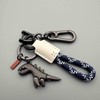 Aluminum Alloy Dinosaur Charm Paired with a Hand-woven Bracelet, Keychain
