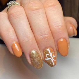 Christmas Press on Nails Short Almond Fake Nails Gold Glitter False Nails with Design Bow Glue on Nails Glossy Acrylic Nail Full Cover Orange Stick on Nails for Women Girls Manicure 24Pcs