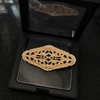Elegant Gold - toned Oval Shaped Filigree Brooch with Crystal