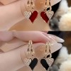 Distinctive Heart-Shaped Dangling Earrings with a Glossy End, Elegantly Easy