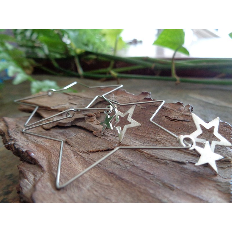 Delicate star hoop earrings made of stainless steel. Star-shaped large