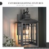 Jafinou Dusk to Dawn Outdoor Wall Sconce, Sand Black Exterior