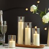 Shihanee Set of 8 Ivory Pillar Candles and Glass Cylinder