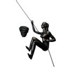 Haute Collage Rock Climbing Woman with her right arm up