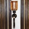 GLOBEDECOR Decorative Wall Sconce, Black Metal Scroll Design, Gold Glass