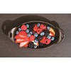 Lodge Heat Enhanced and Seasoned Cast Iron Oval Mini Server,