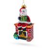 Cozy Santa Sitting on Fireplace Glass Christmas Ornament