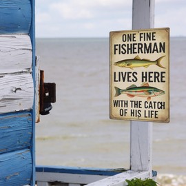 Putuo Decor Funny Fishing Sign for Lake House Gone Fishing Tin Sign Vintage One Fine Fisherman Lives Here with The Catch of His Life Metal Signs for Fishing Gifts Fisherman Decor 8x12 Inches