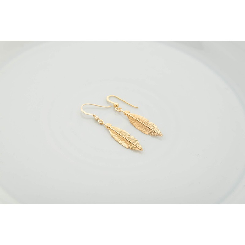Gold feather statement drop earrings