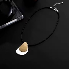 Graci8, The Rita Necklace. Women's necklace, a single strand wax cord with Raindrop shaped copper disc & larger silver raindrop shaped plate behind. Adjustable clasp.