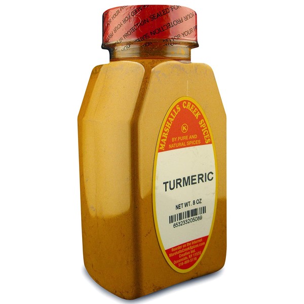 TURMERIC POWDER FRESHLY PACKED IN LARGE JARS, spices, herbs, seasonings