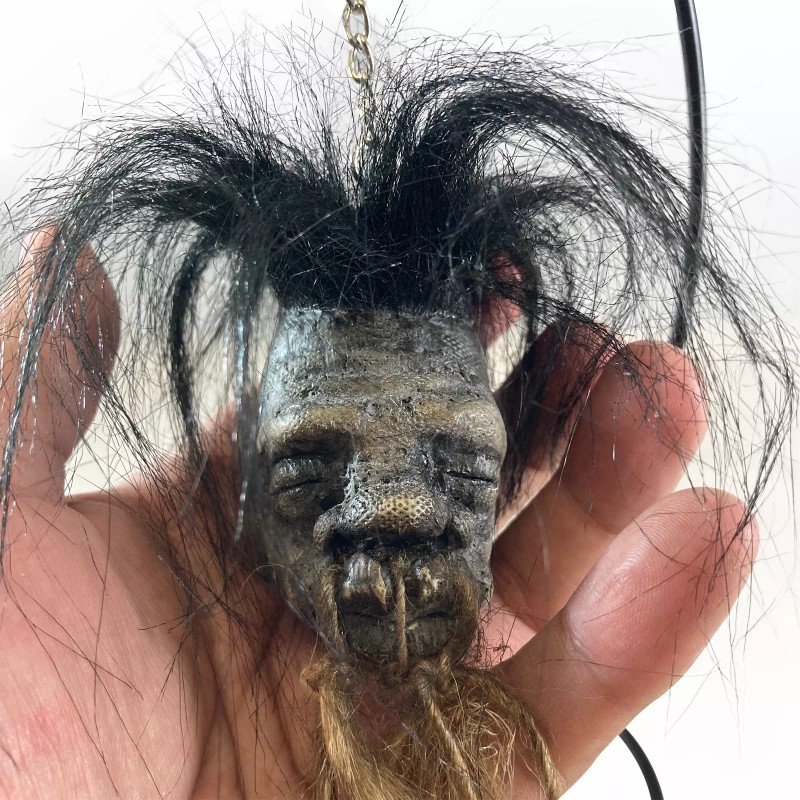 Shrunken Head with Hair Metal Stand Oddity Magic Ritual Voodoo