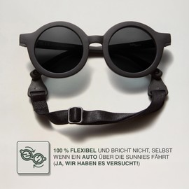 BABYMOCS Runde Babysonnenbrille 0-1,5 Jahre | 100% UV-Schutz | Flexibel | BPA-frei | Ungiftige Sonnenbrille für Babys mit Band | Schwedisches Design | Kindersonnenbrille (Schwarz)