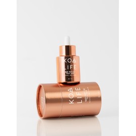 KOA Life NAD Peptide Facial Daily Anti-Aging Serum. in a Metallic Copper Glass Dropper Bottle and Metallic Copper Outer Cylinder Carton