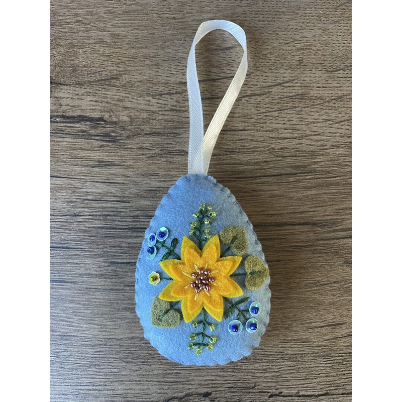 Handmade felt Easter decoration Easter egg with yellow flower