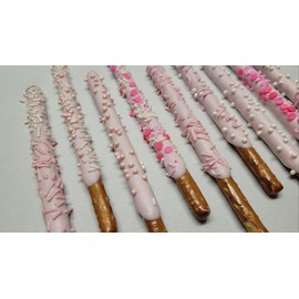 Gender Reveal Pink Chocolate Pretzel Rods with Pink Sprinkles and assorted toppings