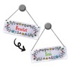Grey toilet is free or occupied reversible sign with flower