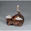 Brown Pelican Trio by John Perry Sculpture on Polished burlwood