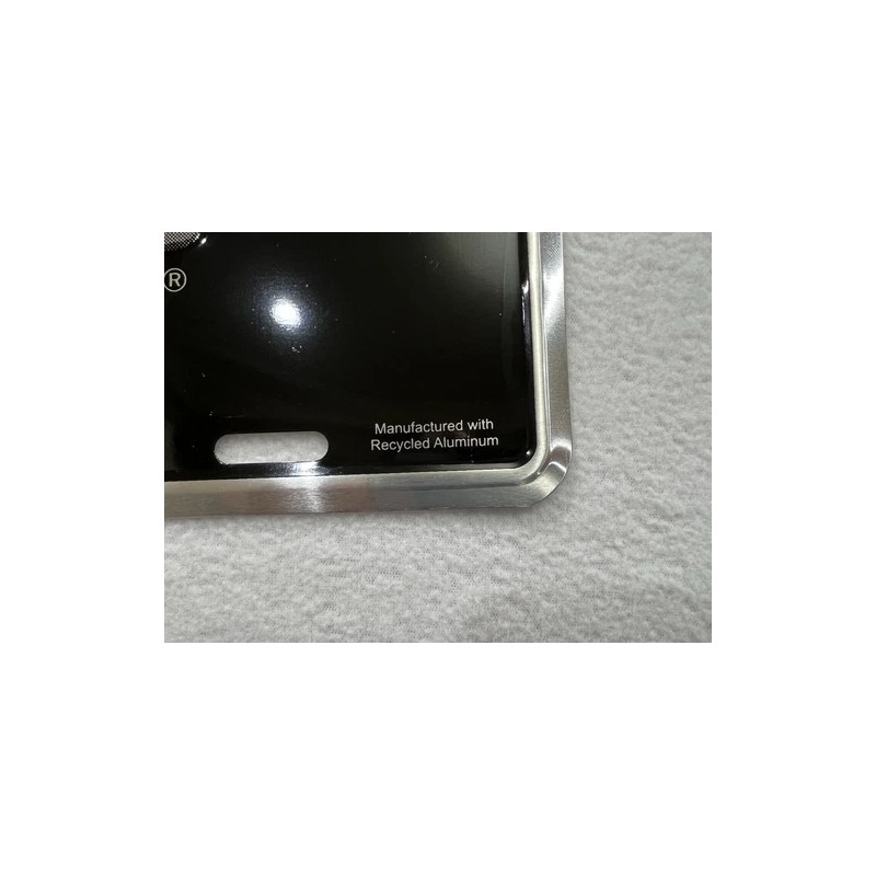 Nissan Embossed Auto License Plate. Black & Silver Aluminum Plate