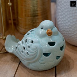 Urban Trends Collection Modern Home Decorative Ceramic Sitting Bird Figurine with Brown Beak and Cutout Design Body Gloss Finish Baby Blue