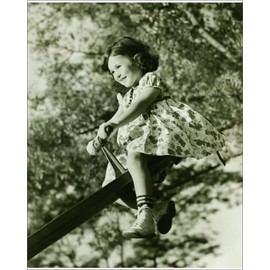 Media Storehouse Black and White Print of Girl on See-Saw in Park - Print 10"x8" (25x20cm) (12304676)