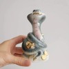 Decorative Ceramic Cobra Figurine with Gold Accents – Symbol of
