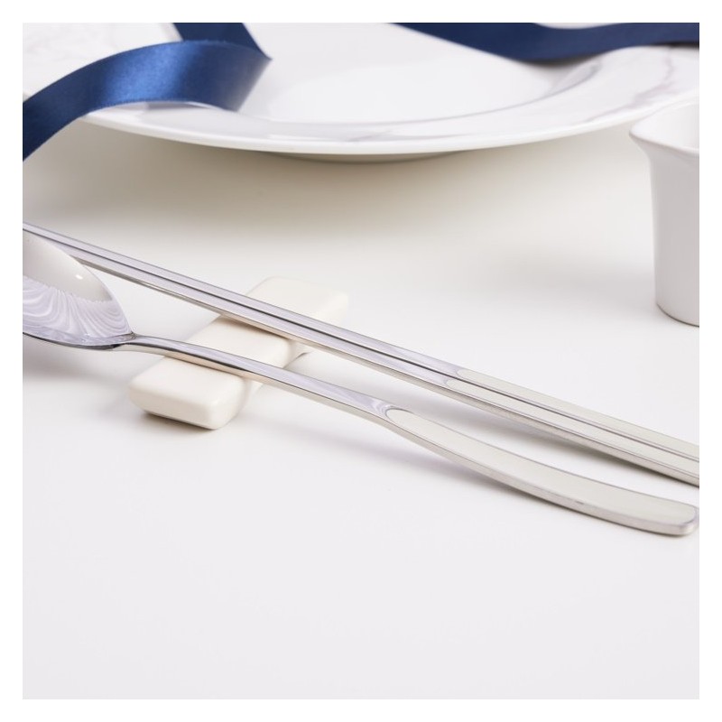 Pristine pastel-colored premium quality domestic cutlery set with good grip,