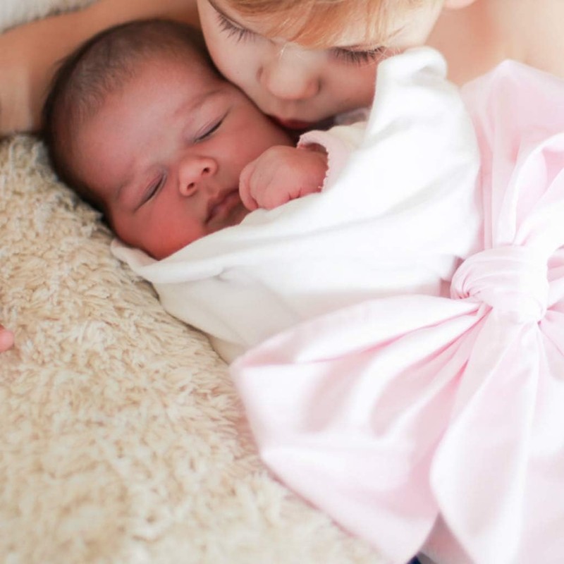 Baby Bag - A Soft Cotton Baby Bonnet in Pink,