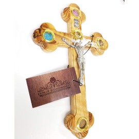 Olive Wood Crucifix / Wall Cross adorned with olive leaves, frankincense, flowers and stones from Jerusalem Hand Crafted by Artisans in Bethlehem (the heart of the holy land). by Bethlehem Gifts TM