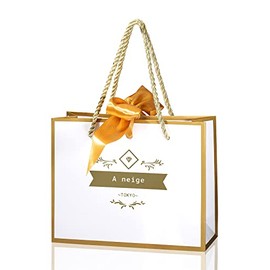 A neige Gift Bag with Gold Ribbon