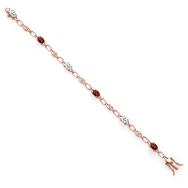 Gem Stone King 18K Rose Gold Plated Silver Sky Blue Aquamarine and Red Garnet and Round White Lab Grown Diamond Tennis Bracelet For Women (3.25 Cttw, Gemstone Birthstone, Oval 6X4MM, 7.25 Inches)