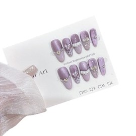 10 pieces of purple and white cat eye color press nails, long almond shaped fake nails, unique 3D crystal diamond pearl and lace design, glued to nails with jelly glue and nail tools to create eye-catching female nail art.