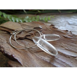 Rock crystal and silver stainless steel hoop earrings. Metal-coloured earrings with transparent, long stone, anti-allergic