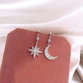 EXINOX Star and Moon Asymmetrical Pendant Earrings: Women, Metal Metal Cristal