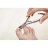 Nipper-type nail clippers for winding nails