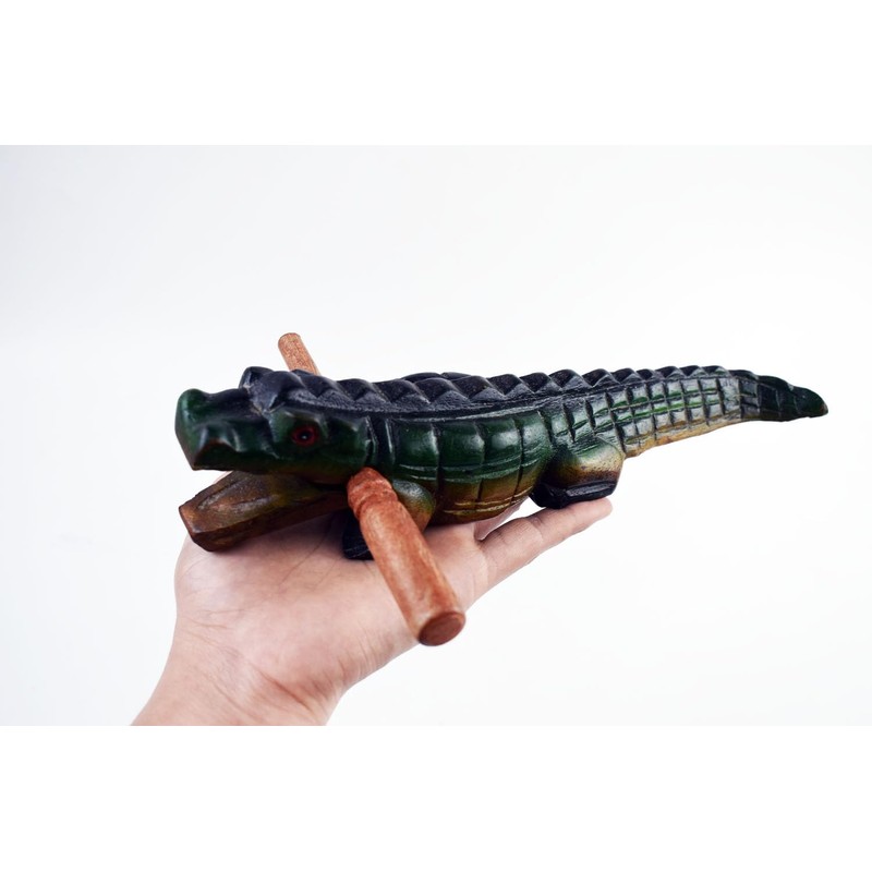 Guiro music percussion instruments wooden sound block animal croaking Alligator