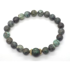 Women's bracelet in green natural turquoise beads and Tibetan beads in gold metal