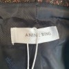 Anine Bing features double breasted closure with a cropped, boxy