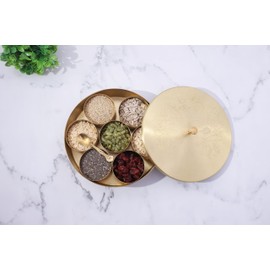 Ajuny Handcrafted Brass Round Spice Box Golden with Embossed Lid - Beautiful Design 7 Spice Containers and 1 Designer Spoon Decorative Masala Canister Organizer Gifts